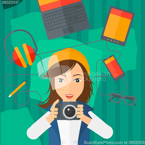 Image of Woman holding camera.