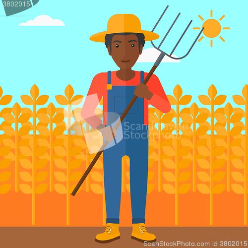 Image of Farmer with pitchfork.