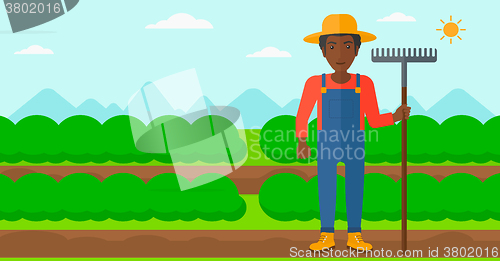 Image of Farmer with rake.