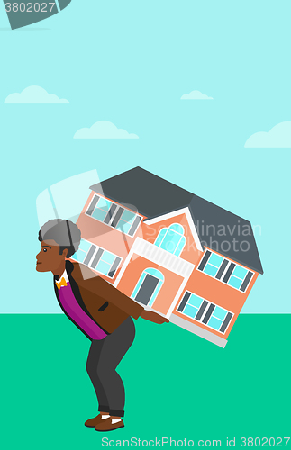 Image of Man carrying house.