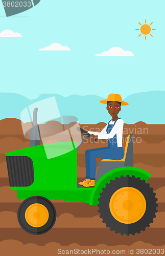 Image of Farmer driving tractor.