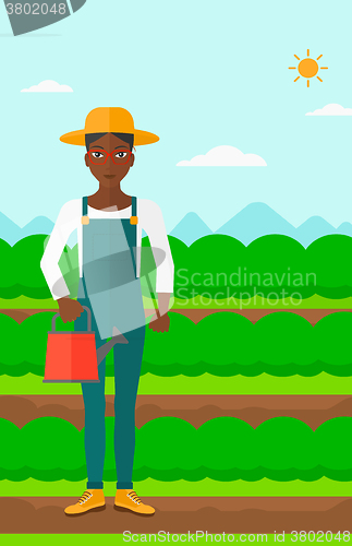 Image of Farmer with watering can.