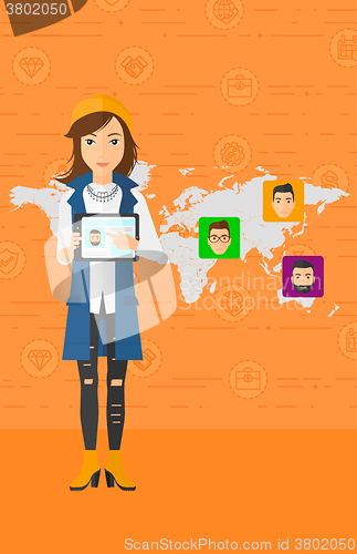 Image of Woman holding tablet computer with social media source.