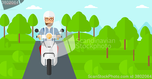 Image of Man riding scooter.