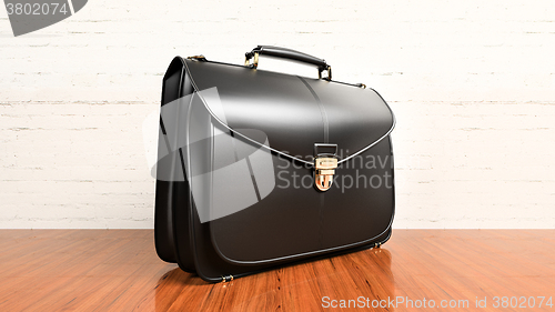 Image of Office desk table with briefcase