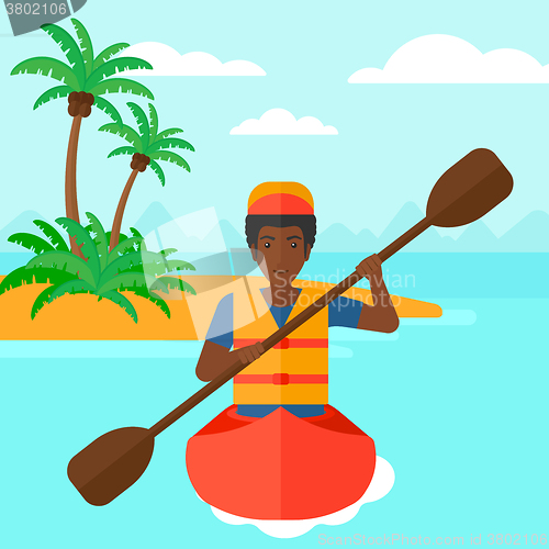 Image of Man riding in canoe.