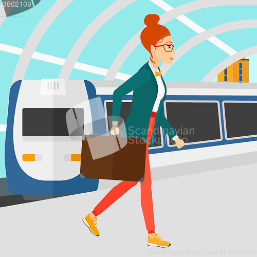 Image of Woman going out of train.