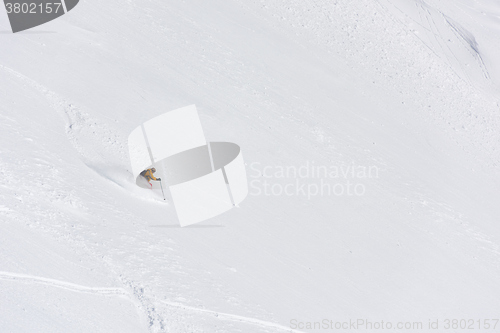 Image of freeride skier skiing in deep powder snow