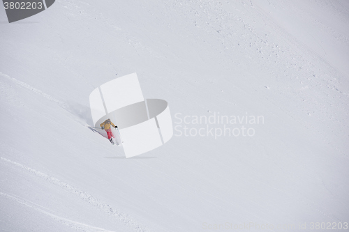 Image of freeride skier skiing in deep powder snow