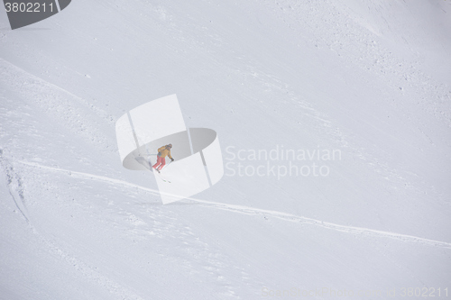 Image of freeride skier skiing in deep powder snow