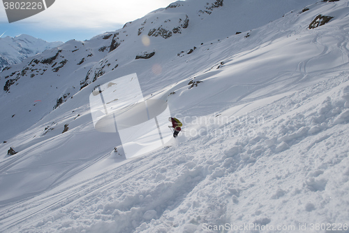 Image of freeride skier skiing in deep powder snow