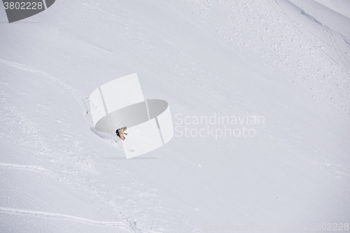 Image of freeride skier skiing in deep powder snow