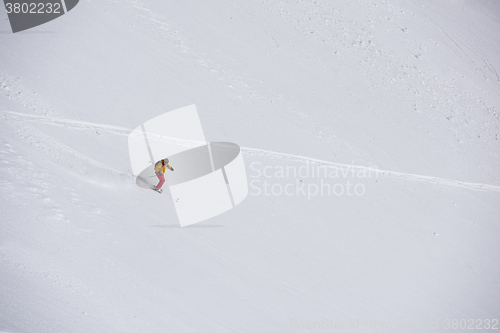 Image of freeride skier skiing in deep powder snow