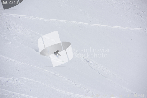 Image of freeride skier skiing in deep powder snow