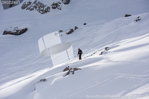 Image of freeride skier skiing in deep powder snow