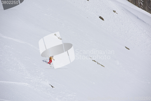 Image of freeride skier skiing in deep powder snow