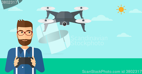 Image of Man flying drone.