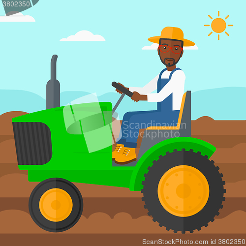 Image of Farmer driving tractor.