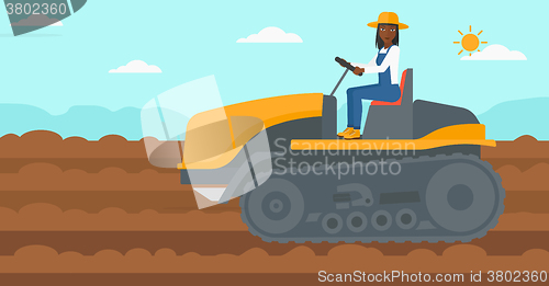 Image of Farmer driving catepillar tractor.