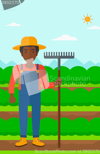 Image of Farmer with rake.