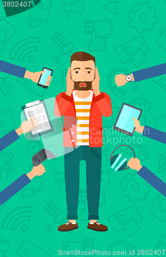 Image of Desperate man with gadgets.