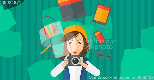 Image of Woman holding camera.