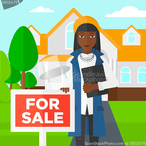 Image of Real estate agent offering house.