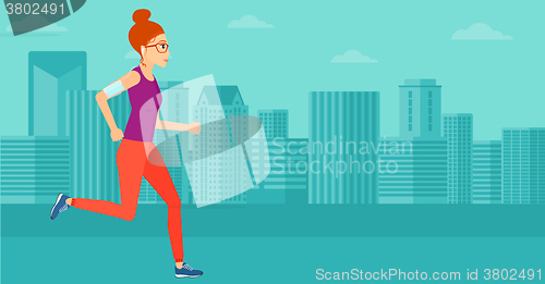 Image of Woman jogging with earphones and smartphone.