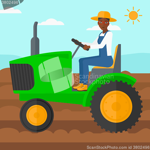 Image of Farmer driving tractor.