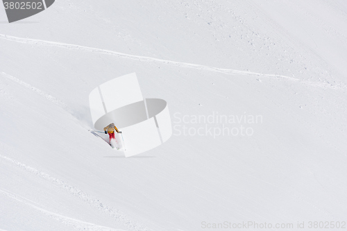 Image of freeride skier skiing in deep powder snow