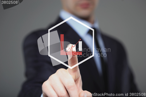 Image of Businessman Touching a Graph Indicating Growth