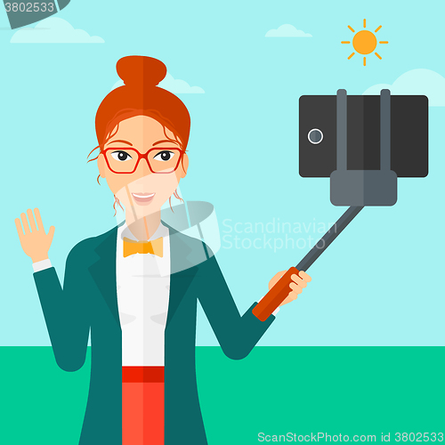 Image of Woman making selfie.