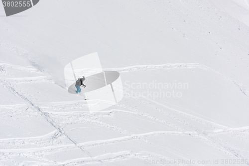 Image of freeride skier skiing in deep powder snow