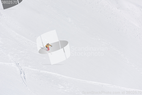 Image of freeride skier skiing in deep powder snow