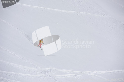 Image of freeride skier skiing in deep powder snow