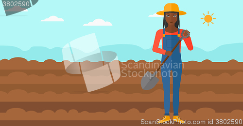 Image of Farmer on the field with shovel.