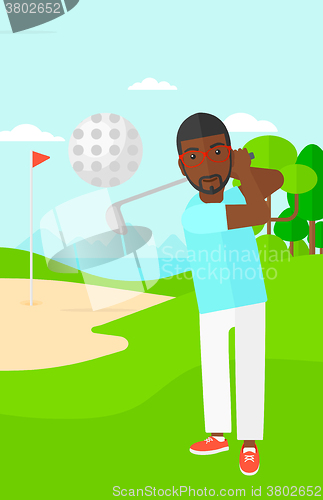 Image of Golf player hitting the ball.