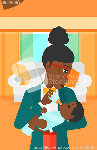 Image of Woman feeding baby.