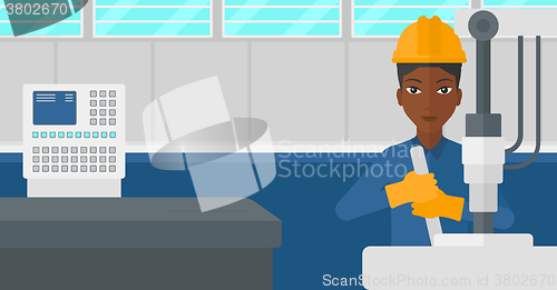 Image of Woman working with industrial equipment.