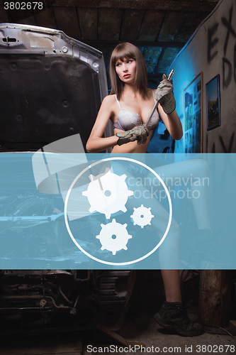 Image of Icon car repairs on the background of a woman mechanic