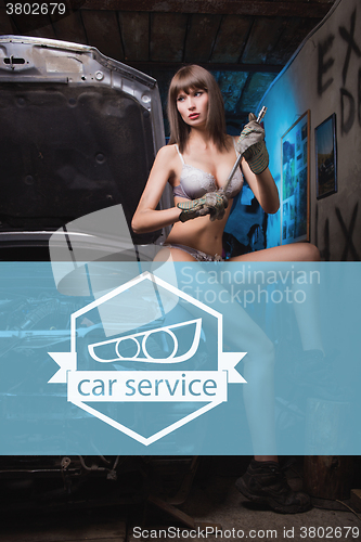 Image of Icon car repairs on the background of a woman mechanic