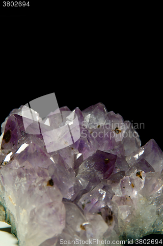 Image of purple amethyst over black vertical