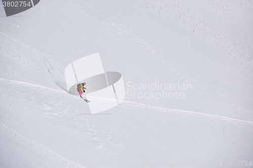 Image of freeride skier skiing in deep powder snow