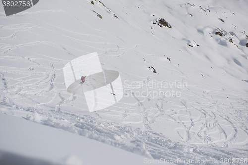 Image of freeride skier skiing in deep powder snow