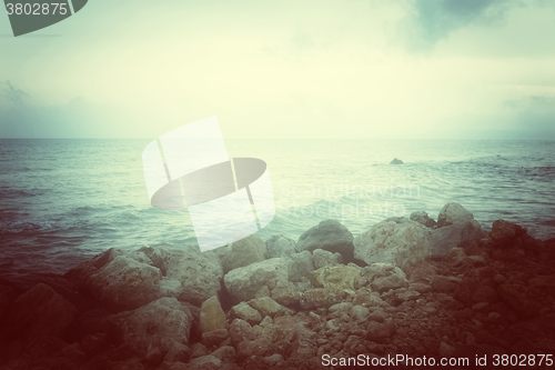 Image of Sea and rocky coast in misty glow