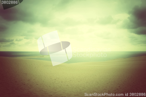 Image of Misty landscape with sand dunes and sea