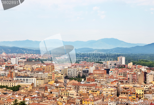 Image of Picturesque city of Girona surrounded by mountains