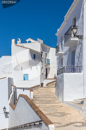 Image of Traditional Andalusian white houses under blue sky