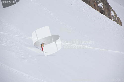 Image of freeride skier skiing in deep powder snow