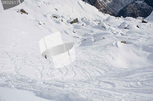 Image of freeride skier skiing in deep powder snow